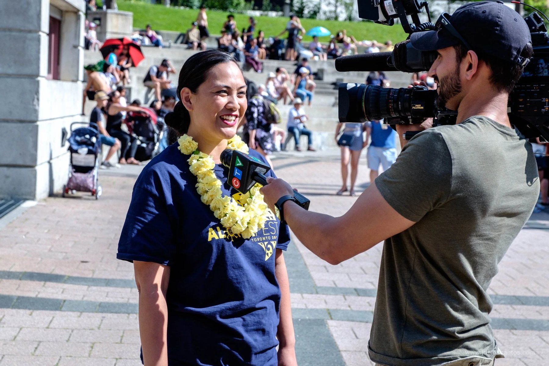 Director Joanne Vicencio being interviewed at Mel Lastman Square